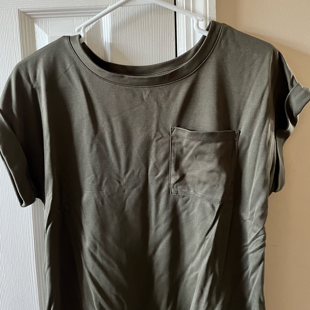 Cuffed, short-sleeved shirt with front pocket.